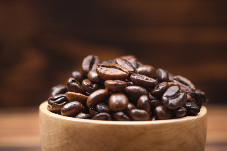 Coffee beans. Coffee cup full of coffee beans.の写真素材