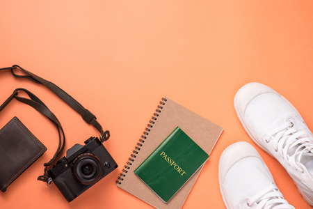Summer traveling concept. Vacation accessories on orange background.の写真素材