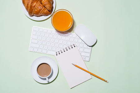 Breakfast with fresh croissants and orange juice, top viewの写真素材