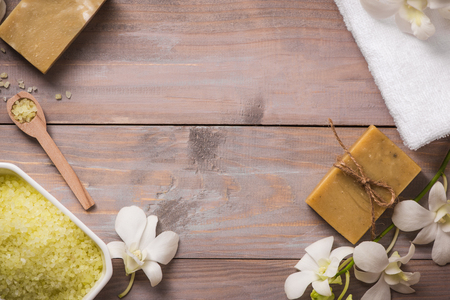 Spa set. Handmade, natural organic soap and white orchid on a wooden backgroundの写真素材