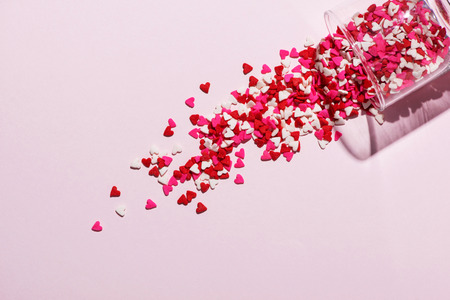 Valentines Day Glass with lots of sweet candy heartsの写真素材