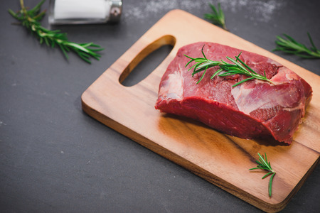 Raw beef meat on a cutting boardの写真素材