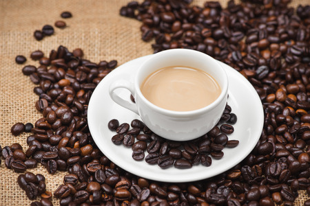 Coffee cup and beans on a rustic backgroundの写真素材