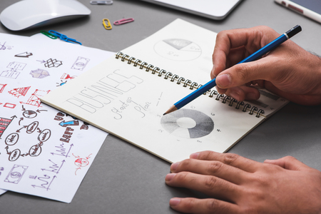 Business concept. Businessman writing idea sketchの写真素材