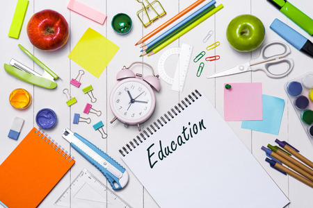 School stationery or office supplies on wood background.の写真素材