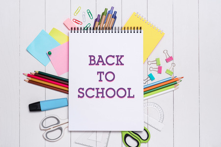 School stationery or office supplies on wood background.の写真素材