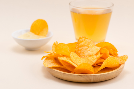 Cheese and onion potato chips with soft drink on table.の写真素材