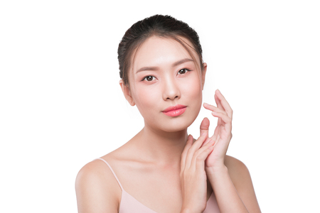 Beautiful woman model touching her face with natural makeupの写真素材