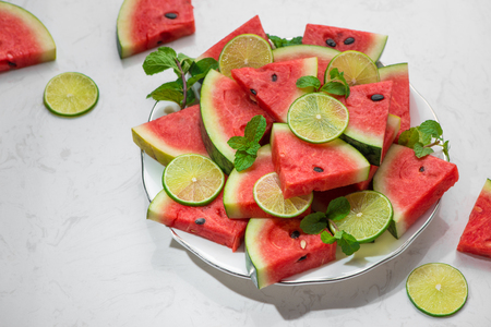Fresh sliced watermelon on a plate in summertimeの写真素材