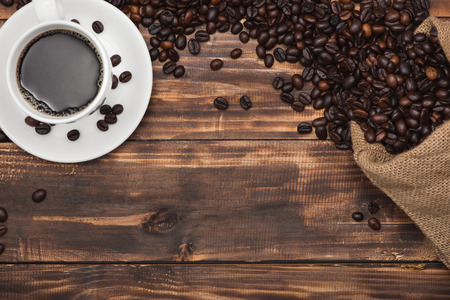 Cup of coffee espresso and beans on a rustic backgroundの写真素材