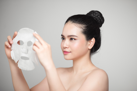 Spa, healthcare. Asian girl with a cosmetic mask.の写真素材