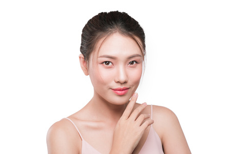 Healthy skin concept. Portrait of beautiful woman model touching her faceの写真素材