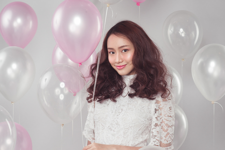 Asian beauty fashion woman with pastel balloonsの写真素材