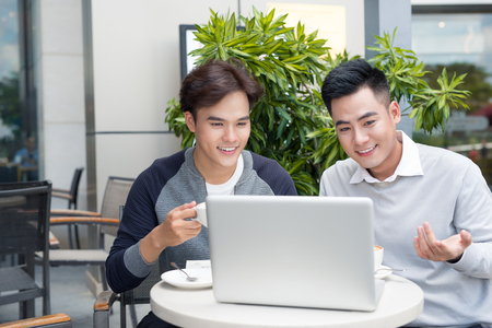 Two businessman having a casual meeting or discussion in the city.の写真素材