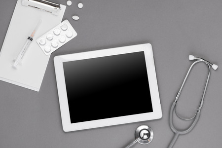 Top view of doctor desk table with stethoscope and medical items. Flat lay.の写真素材