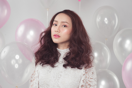 Asian beauty fashion woman with pastel balloonsの写真素材