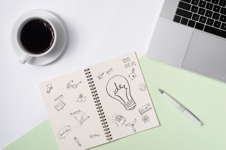 Business ideas, creativity, inspiration and start up concepts, ideas message on notebook with lightbulb.の写真素材