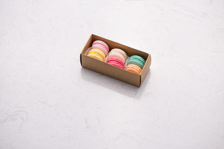 Sweet macarons. Different french cookies macaroons in a paper box.の写真素材