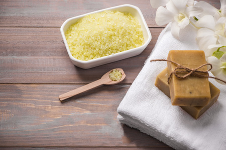 Spa set. Handmade, natural organic soap and white orchid on a wooden backgroundの写真素材