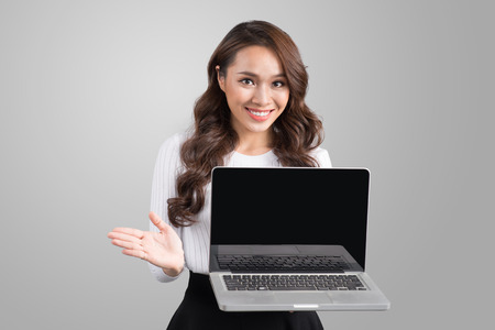 Confident asian business woman showing laptop screen.の写真素材