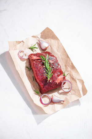 Raw fresh beef on white stone background, top viewの写真素材