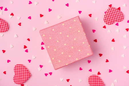 Delicate pink party background with streamers for celebrating with scattered confettiの写真素材