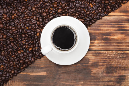 Coffee cup and beans on a rustic backgroundの写真素材