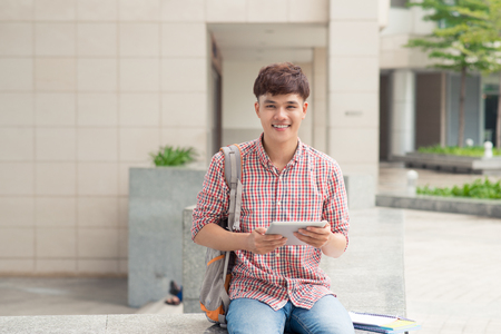 Student using digital tablet  in university schoolの写真素材