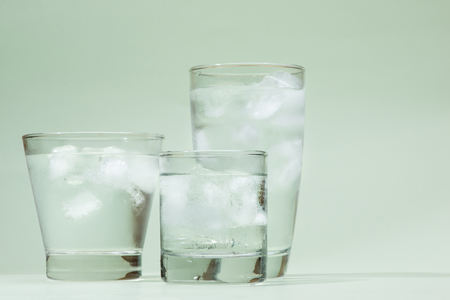 Cold fresh drinking water in glass on tableの写真素材