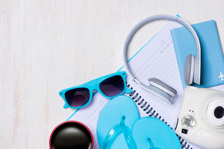 Summer holiday background, Travel and vacation items on wooden table. Top viewの写真素材