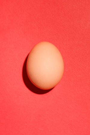 Top view of traditional red easter eggs on red background.の写真素材