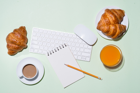Breakfast with fresh croissants and orange juice, top viewの写真素材