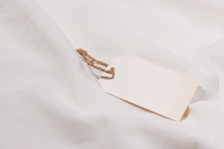 White silk with blank price tag with stringの写真素材