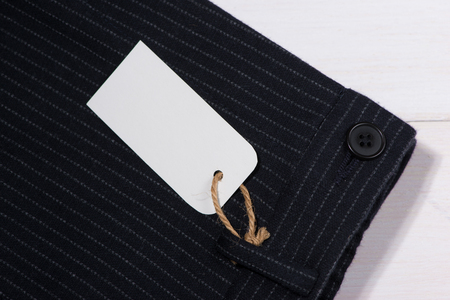 Blank paper label with string on pantsの写真素材