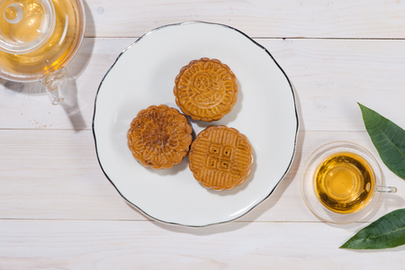 Mooncake and tea, Chinese mid autumn festival food. Angle view from aboveの写真素材