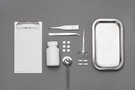 Top view of doctor desk table with stethoscope and medical items. Flat lay.の写真素材
