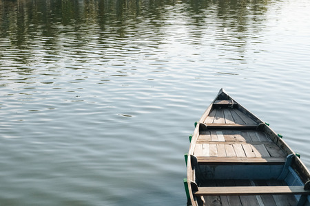 Reflection in the water of boats over nature backgroundの写真素材