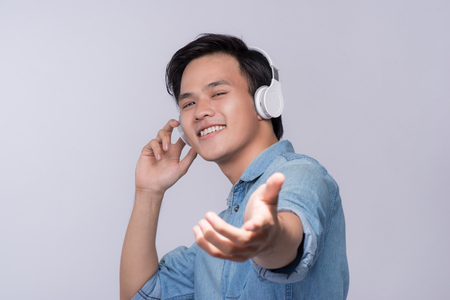 Smart casual asian man with headphone in studio backgroundの写真素材