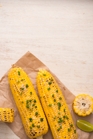 Tasty sweet grilled corn with onion sauceの写真素材