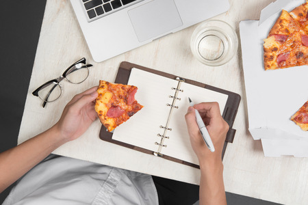 Office worker having a lunch break in the office, flat layの写真素材
