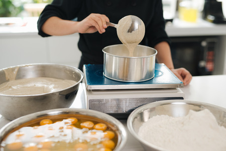 Bakery chef cooking bake in the kitchen professionalの写真素材