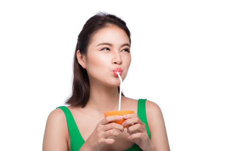 Beautiful asian girl with juice, isolated on whiteの写真素材