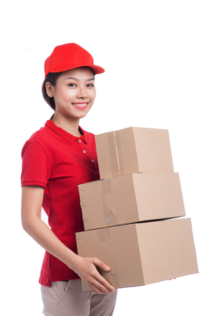 Portrait of delivery woman service happily delivering package to costumerの写真素材
