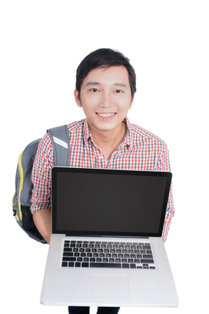 Portrait of young asian student holding and showing screen laptopの写真素材