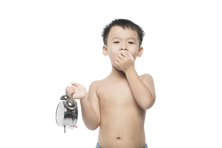 Asian boy child yawn. Isolated on white.の写真素材