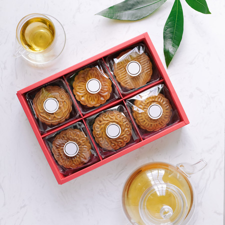 Mid-autumn festival mooncake minimalist style tea party table. Flat lay.の写真素材