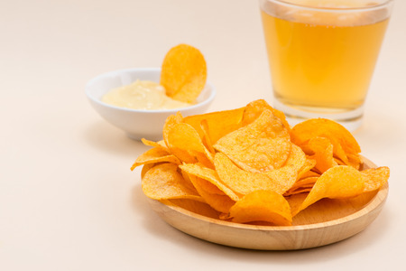 Cheese and onion potato chips with soft drink on table.の写真素材