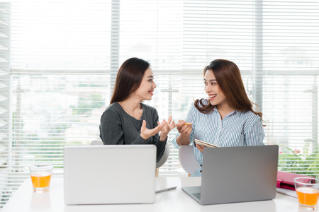 Teamwork. Businesspeople working together with laptop in office.の写真素材
