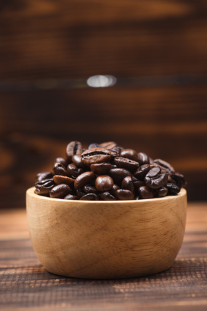Coffee beans. Coffee cup full of coffee beans.の写真素材