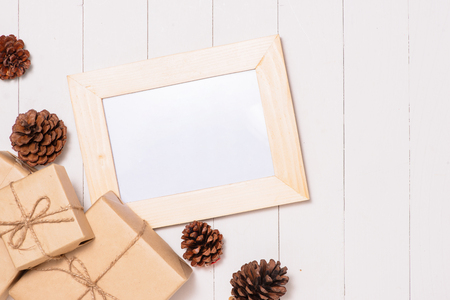 Christmas presents in decorative boxes on white wooden table backgroundの写真素材